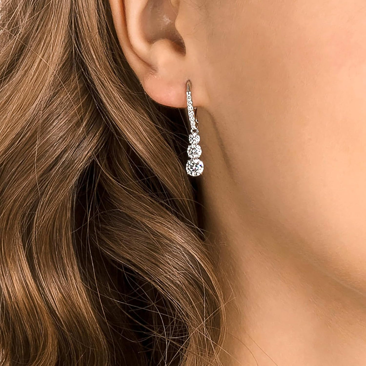 Swarovski Stilla Attract Trilogy Drop Pierced Earrings with White Crystals on a Rhodium Plated Setting with Hinged Closure